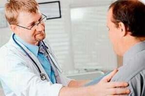 A man with prostatitis at an appointment with the doctor